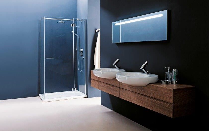 Bathroom in dark blue with wood effect sinks