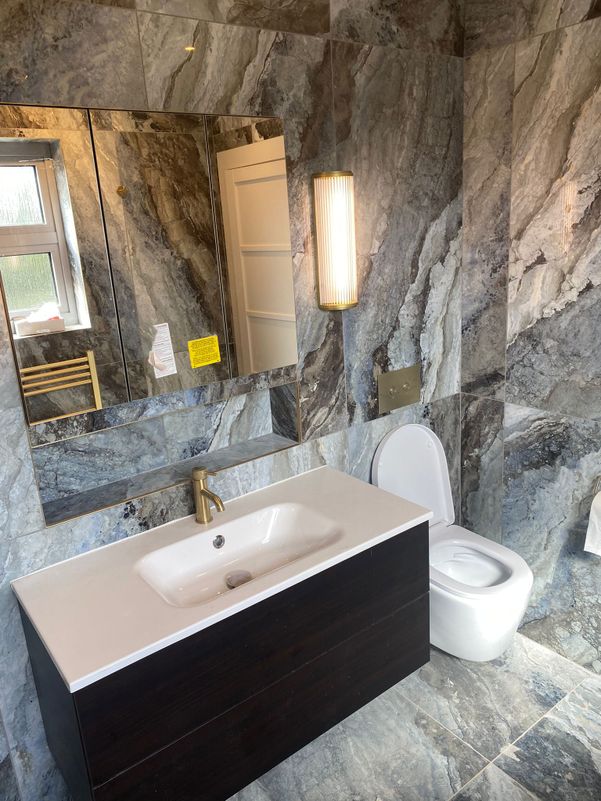 grey ceramic and gold bathroom