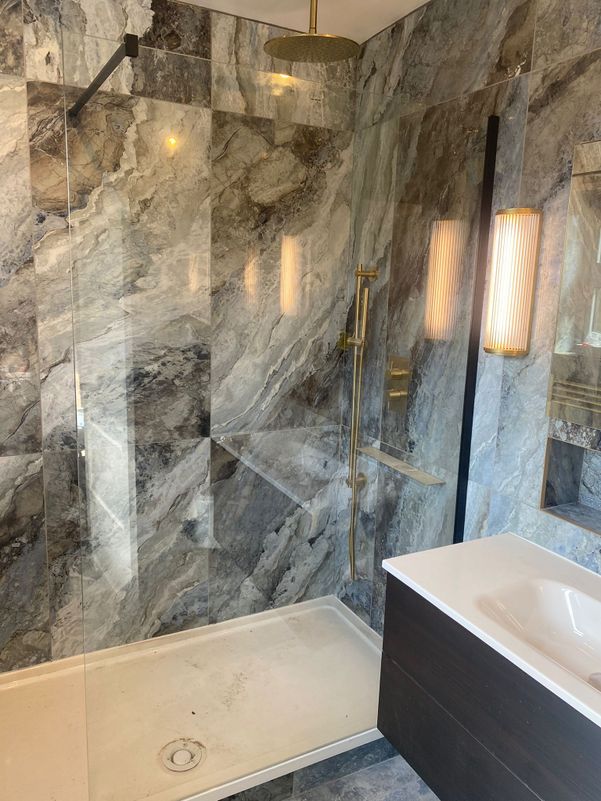 grey ceramic and gold bathroom