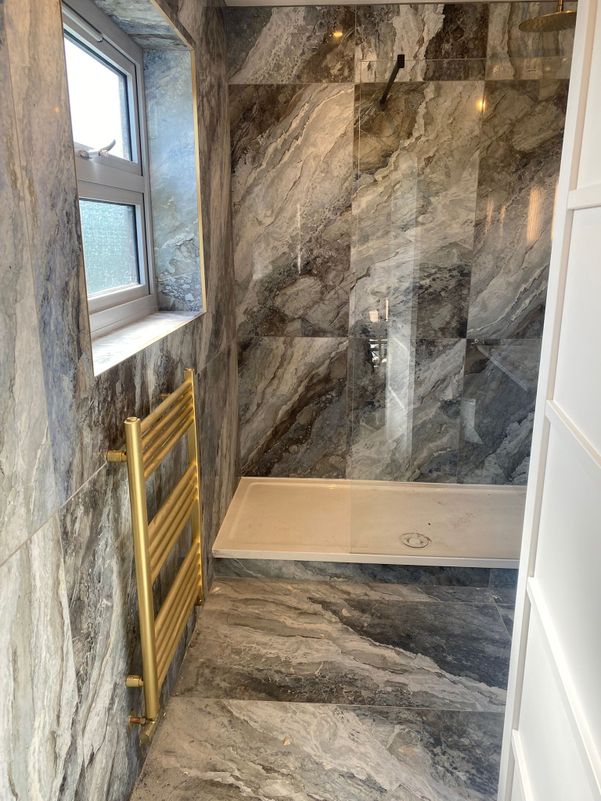grey ceramic and gold bathroom