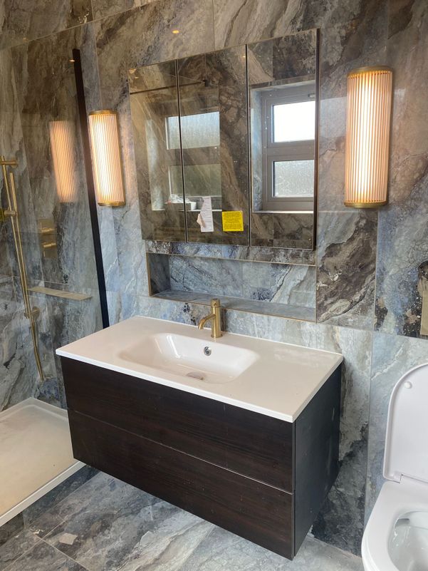 grey ceramic and gold bathroom
