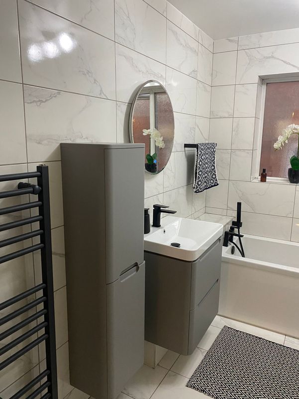 Bathroom sink installation black, grey and white with luminous mirror