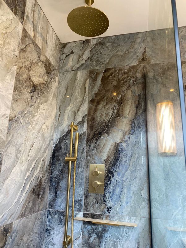 grey ceramic and gold bathroom