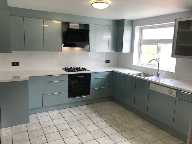 Light grey blue and white shiny kitchen