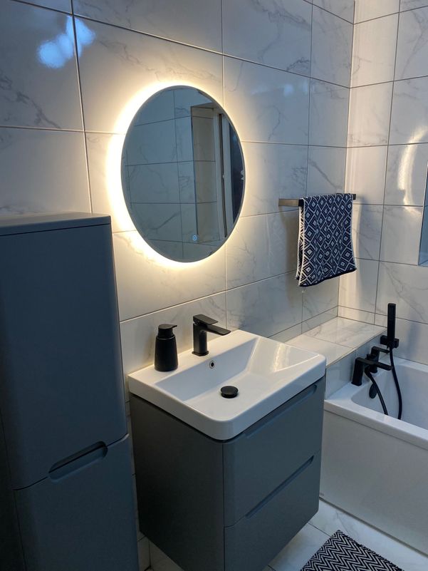 Bathroom sink installation black, grey and white with luminous mirror